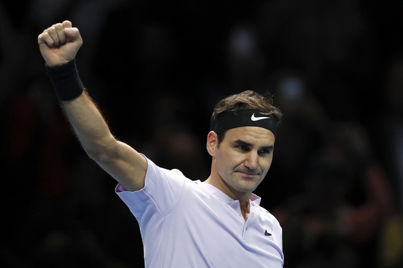 Roger Federer of Switzerland celebrates at match point after beating Jack Sock of the United States in their singles tennis match at the ATP World Finals at the O2 Arena in London, Sunday, Nov. 12, 20 ...