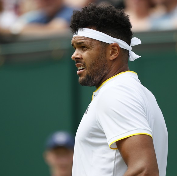 epa06063154 Jo-Wilfried Tsonga of France takes on Cameron Norrie of Britain in their first round match during the Wimbledon Championships at the All England Lawn Tennis Club, in London, Britain, 03 Ju ...