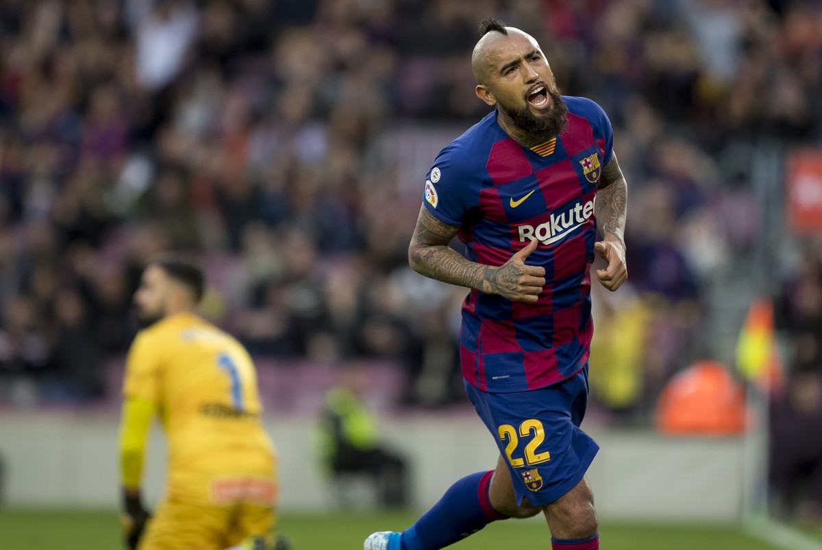 Barcelona's Arturo Vidal celebrates after scoring a goalduring a Spanish La Liga soccer match between Barcelona and Alaves at Camp Nou stadium in Barcelona, Spain, Saturday, Dec. 21, 2019. (AP Ph ...