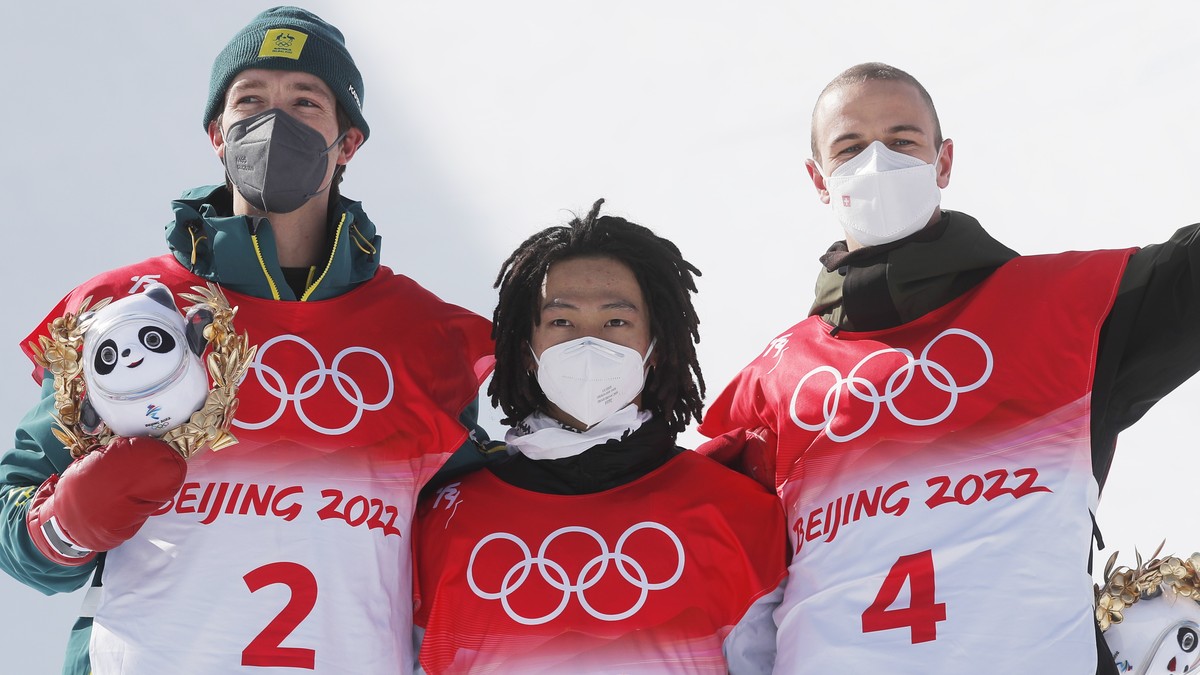 epa09745599 (L-R) Silver medalist Scotty James of Australia, gold medalist Ayumu Hirano of Japan and bronze medalist Jan Scherrer of Switzerland pose on the podium at the conclusion of the Men's  ...
