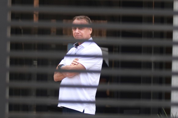 FILE - Brazil's former President Jair Bolsonaro stands at the entrance of his home while he is under house arrest in Brasilia, Brazil, Sept. 2, 2025. (AP Photo/Luis Nova, File)
Brazil Bolsonaro