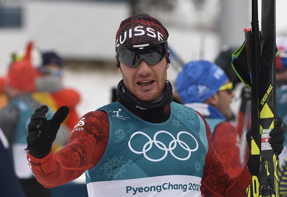 epa06514105 6th placed Dario Cologna of Switzerland reacts after the Men&#039;s Cross Country 15 km + 15 km Skiathlon race at the Alpensia Cross Country Centre during the PyeongChang 2018 Olympic Game ...