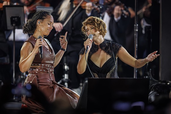 epa13084749 British singer-songwriter Raye (R) performs with American singer-songwriter Alicia Keys (L) on the Stravinski stage on the opening night of the 60th Montreux Jazz Festival (MJF) in Montreu ...