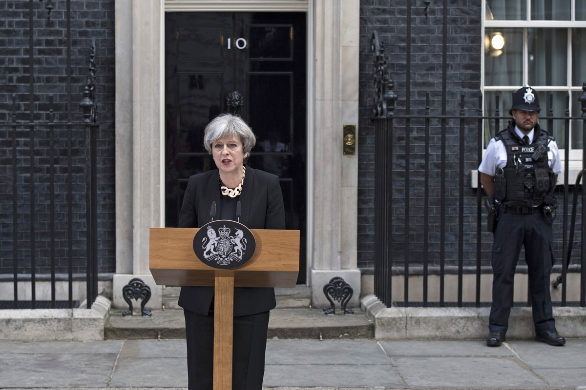 epa06009414 British Prime Minister Theresa May delivers a statement on the previous night's terrorist incident, at Downing Street, in London, Britain, 04 June 2017. At least seven members of the  ...