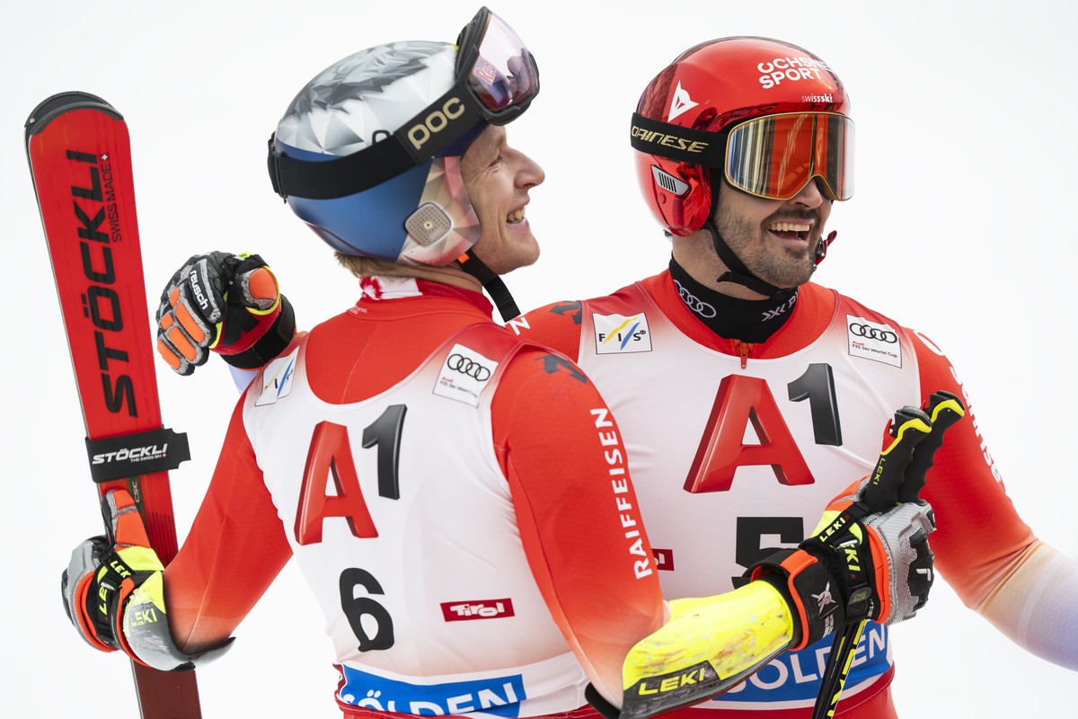 Loic Meillard of Switzerland, right, and Marco Odermatt of Switzerland celebrate in the finish area during the second run of the mens Giant Slalom race of the FIS Alpine Ski World Cup season opener o ...