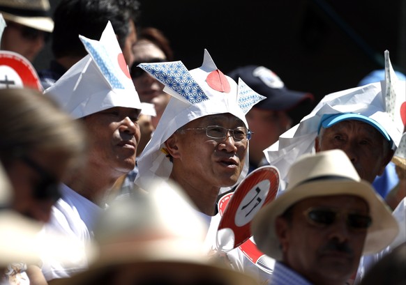 Japanese supporters watch as Japan&#039;s Kei Nishikori plays Ukraine&#039;s Sergiy Stakhovsky in a Men&#039;s Singles Match on day three at the Wimbledon Tennis Championships in London Wednesday, Jul ...