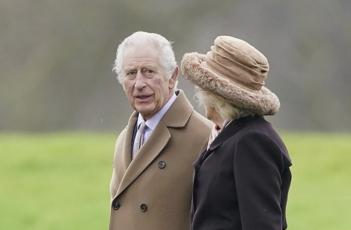Britain's King Charles III, left, and Queen Camilla leave after attending a Sunday church service at St Mary Magdalene Church in Sandringham, Norfolk, England, Sunday Feb. 18, 2024. (Joe Giddens/ ...