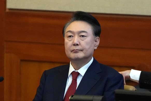 FILE - South Korea's impeached President Yoon Suk Yeol attends a hearing of his impeachment trial at the Constitutional Court in Seoul, South Korea, Feb. 11, 2025. (AP Photo/Lee Jin-man, Pool, Fi ...