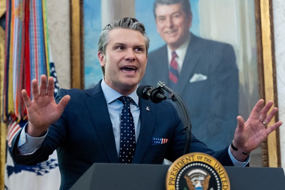 Defense Secretary Pete Hegseth speaks during the swearing-in for Homeland Security Secretary Markwayne Mullin in the Oval Office of the White House, Tuesday, March 24, 2026, in Washington. (AP Photo/A ...