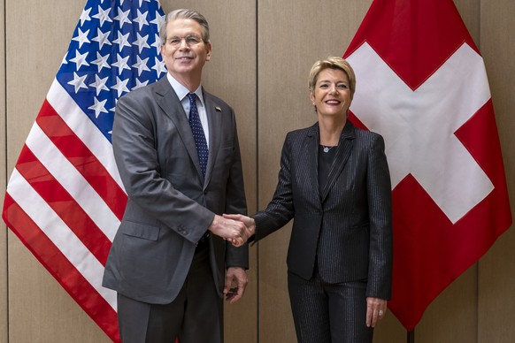 epa12086667 US Secretary of the Treasury Scott Bessent (L), shakes hands with Switzerland&#039;s President Karin Keller-Sutter (R), during a bilateral meeting between Switzerland and the United States ...
