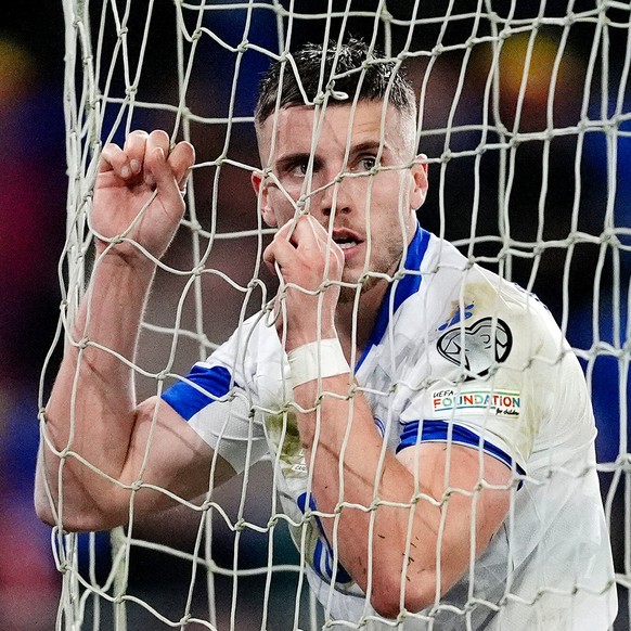 Bosnia and Herzegovina's Ermedin Demirovic reacts after a missed opportunity during the World Cup playoff semifinal soccer match between Wales and Bosnia and Herzegovina in Cardiff, Wales, Thursd ...