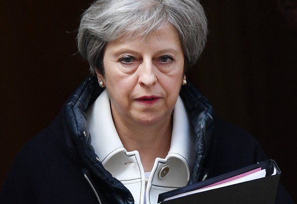 epa06673217 British Prime Minster Theresa May departs 10 Downing Street for parliament in London, Britain, 16 April 2018. May is set to deliver on the day a statement on Syria to members of parliament ...