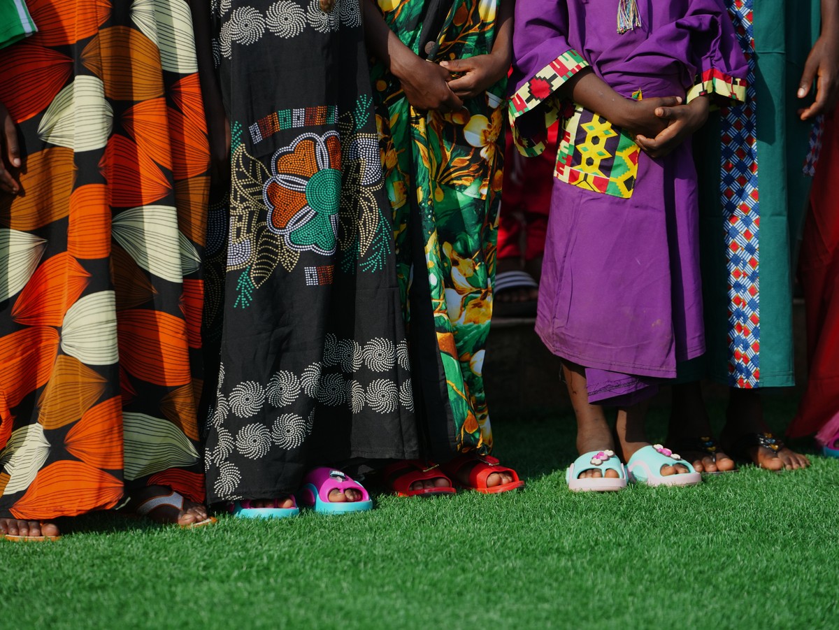 Freed students of St. Mary's Catholic School in the Papiri community pose for photographs upon their arrival at the government house, in Minna, Nigeria, Monday, Dec. 22, 2025. (AP Photo/Sunday Al ...