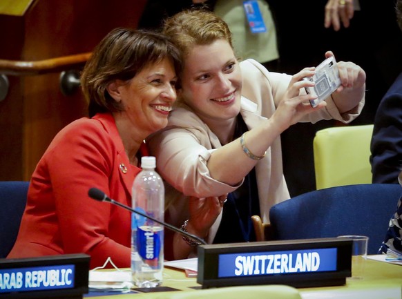 Switzerland&#039;s Federal Councillor Doris Leuthard, left, make a selfie with Sophie Neuhaus, representative of National Council of Switzerland, before addressing a ministerial meeting of the 2018 Hi ...