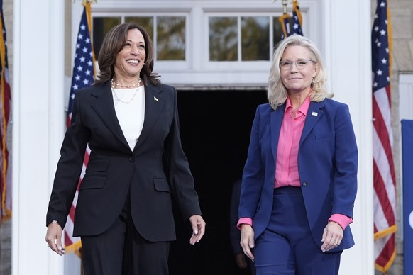 Democratic presidential nominee Vice President Kamala Harris, left, arrives to speak at a campaign event with former Congresswoman Liz Cheney, R-Wyo., right, at Ripon College in Ripon, Wis., Thursday, ...