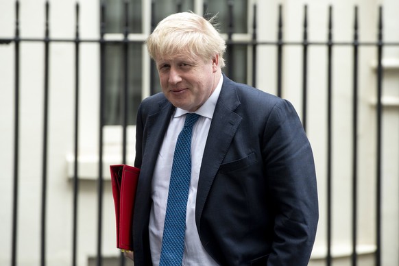 epa06659883 British Foreign Secretary Boris Johnson leaves Downing Street after attending a meeting of the National Security Council to discuss the suspected chemical attack in Syria in London, Britai ...