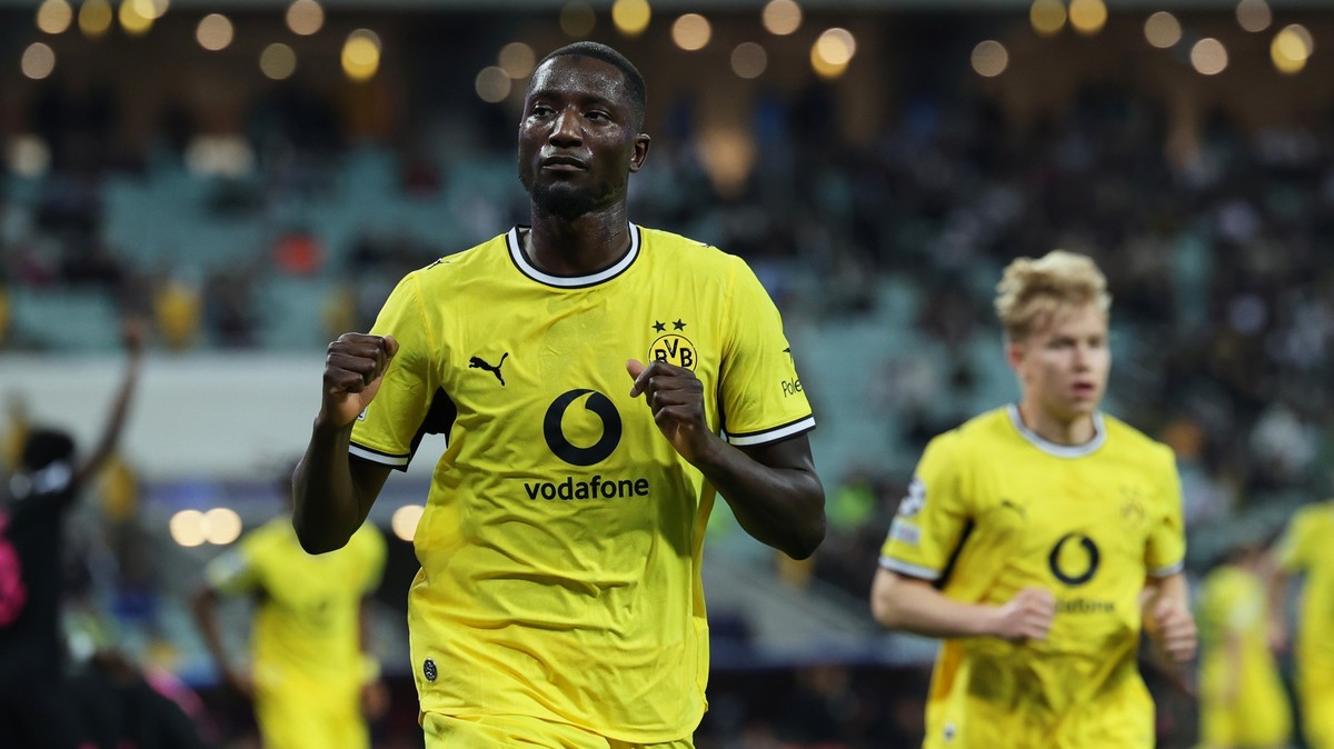Borussia's Serhou Guirassy celebrates after scoring his side's first goal during the Champions League opening phase soccer match between Sabah FK and Borussia Dortmund in Baku, Azerbaijan, T ...