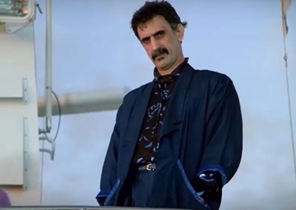 Frank Zappa in Miami Vice 

https://faroutmagazine.co.uk/frank-zappa-miami-vice-cameo-video-1986/