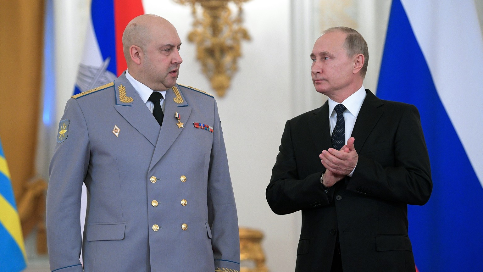 FILE - Russian President Vladimir Putin, right, applauds Col. Gen. Sergei Surovikin during an awards ceremony for troops who fought in Syria, in the Kremlin, in Moscow, Russia, Thursday, Dec. 28, 2017 ...