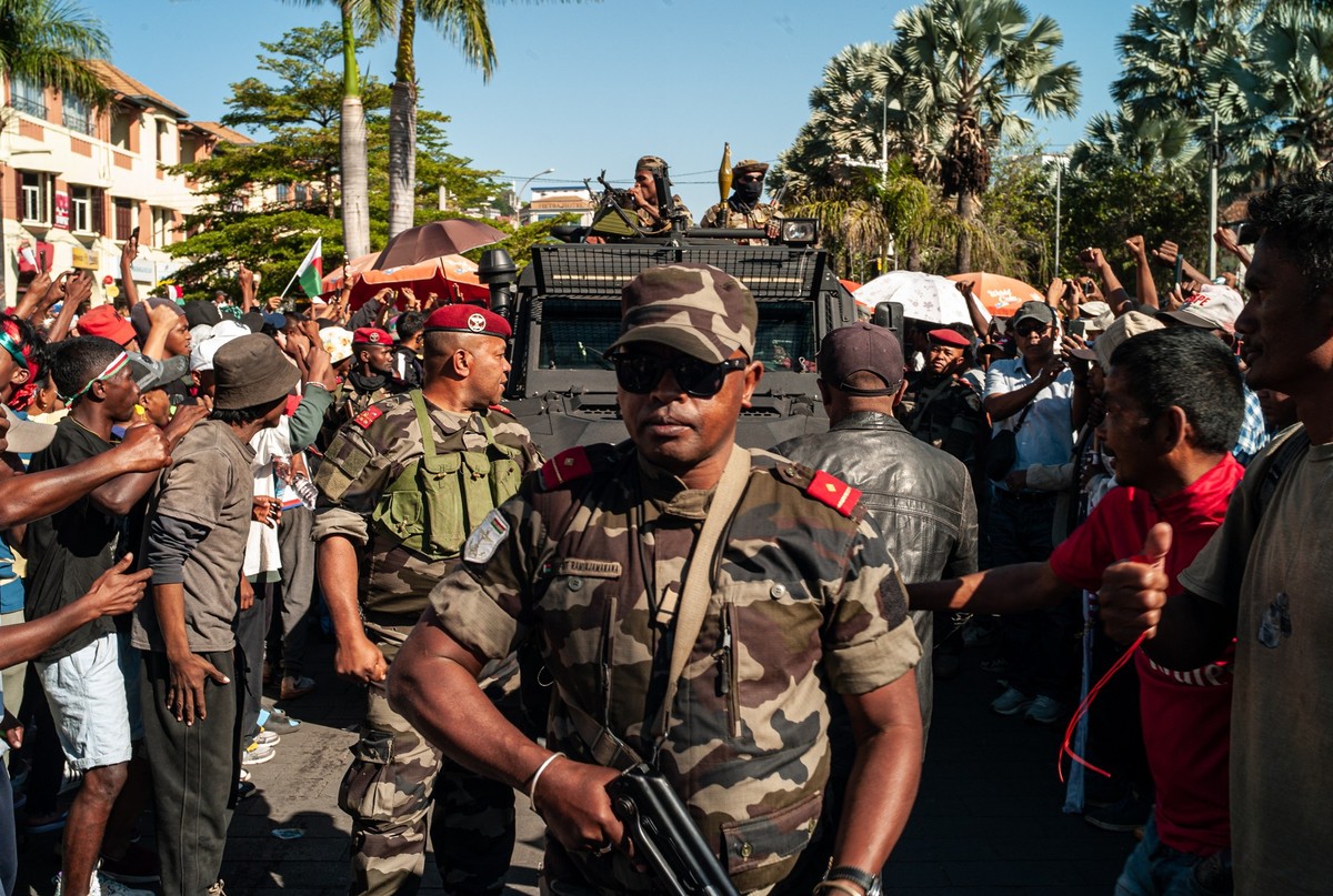epa12453693 Protesters welcome members of the military a during a rally in Antananarivo, Madagascar, 14 October 2025. Madagascar's president Andry Rajoelina has confirmed he has fled the country  ...