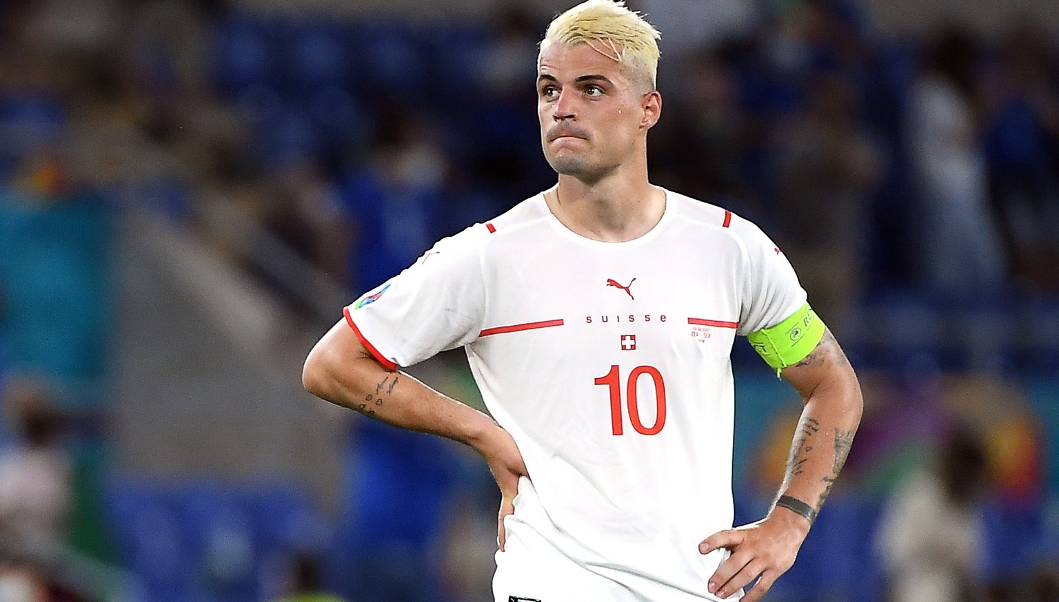 epa09278329 Granit Xhaka of Switzerland reacts after the UEFA EURO 2020 group A preliminary round soccer match between Italy and Switzerland in Rome, Italy, 16 June 2021. EPA/Ettore Ferrari / POOL (RE ...