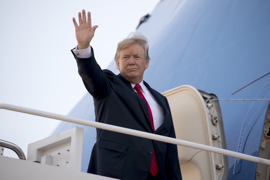 President Donald Trump waves as he boards Air Force One at Andrews Air Force Base, Md., Friday, Nov. 3, 2017, to travel to Joint Base Pearl Harbor Hickam, in Hawaii. Trump begins a 5 country trip thro ...