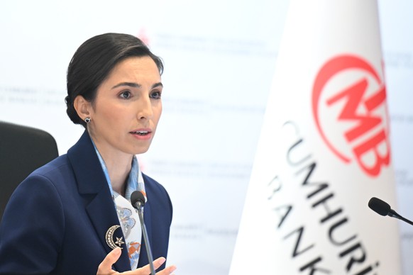 epa10771617 A handout photo made available by the Turkish Central Bank Press Office shows.Turkish Central Bank Governor Hafize Gaye Erkan speaks at a press conference as she makes a presentation and a ...