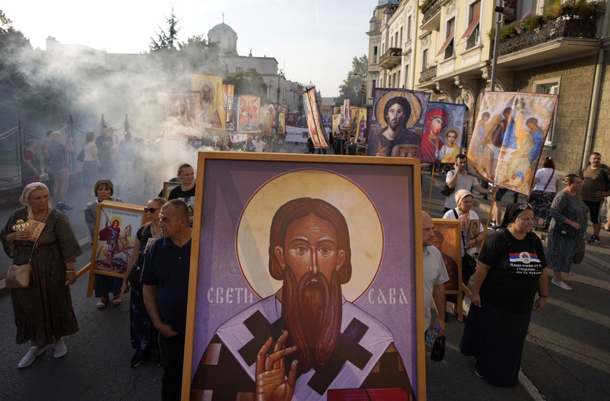 People march during a protest against the international LGBT event Euro Pride in Belgrade, Serbia, Sunday, Aug. 28, 2022. Members of the European Pride Organizers Association chose Serbia&#039;s capit ...