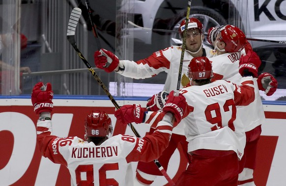 Russia players celebrate after scoring during the Ice Hockey World Championships group B match between Switzerland and Russia at the Ondrej Nepela Arena in Bratislava, Slovakia, Sunday, May 19, 2019.  ...