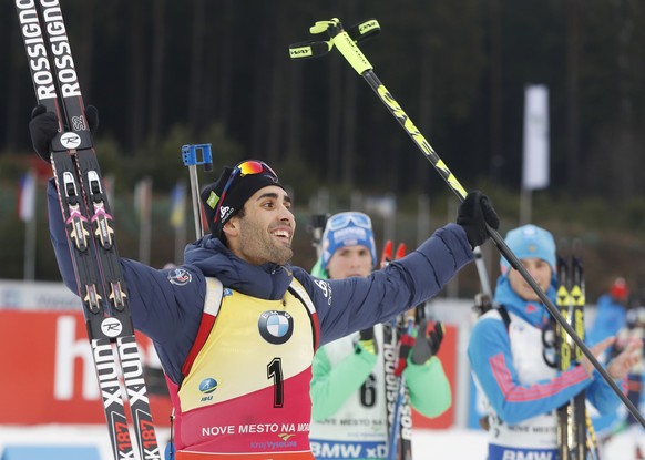 France&#039;s Martin Fourcade celebrates winning the men&#039;s Biathlon World Cup 15 km mass start event in Nove Mesto na Morave, Czech Republic, Sunday, Dec. 18, 2016. (AP Photo/Petr David Josek)