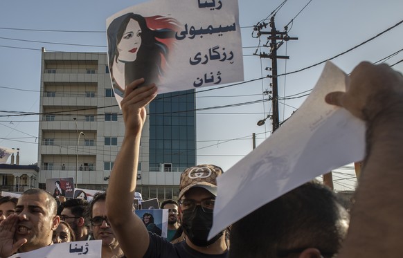 Protesters gather in Sulaimaniyah, Iraq, on Sept. 28, 2022, to protest the killing of Mahsa Amini, an Iranian Kurdish woman, after she was arrested in Tehran by morality police for wearing her headsca ...