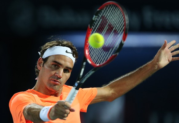 Roger Federer of Switzerland returns the ball to Fernando Verdasco of Italy during the Dubai Duty Free Tennis Championships in Dubai, United Arab Emirates, Wednesday, Feb. 25, 2015. (AP Photo/Kamran Jebreili)