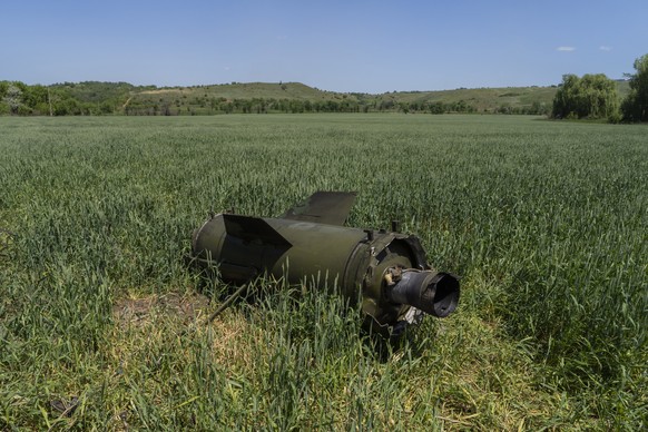 The wreckage of a Russian missile lays on a wheat field near Soledar, eastern Ukraine, Monday, June 6, 2022. (AP Photo/Bernat Armangue)