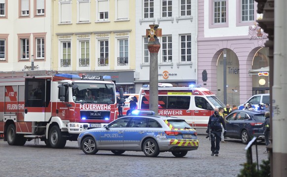 A square is blocked by the police in Trier, Germany, Tuesday, Dec. 1, 2020. German police say two people have been killed and several others injured in the southwestern German city of Trier when a car ...