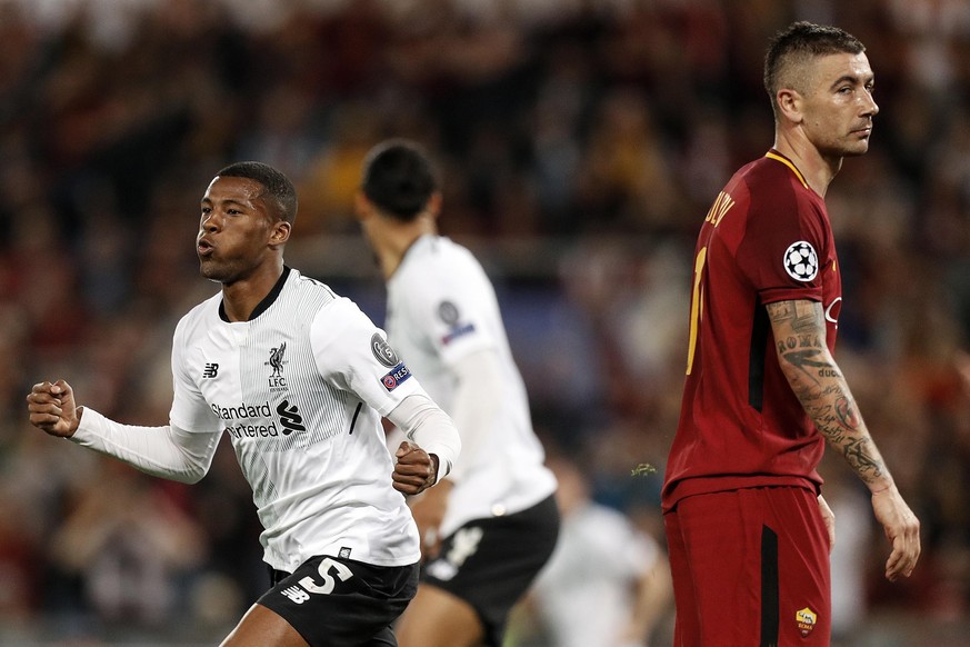 epa06707500 Liverpool&#039;s Georgino Wijnaldum (L) celebrates after scoring the 2-1 lead next to Roma&#039;s Aleksandar Kolarov (R) during the UEFA Champions League semi final, second leg soccer matc ...