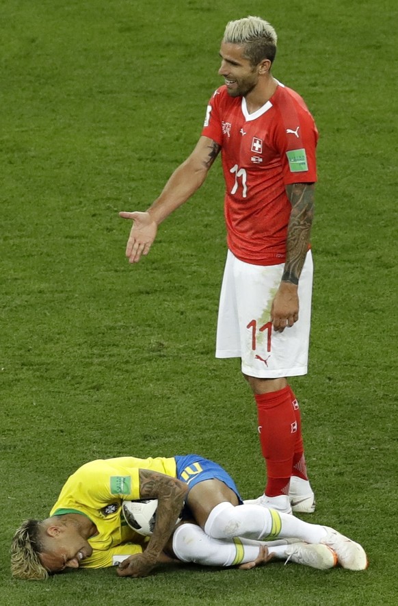 Switzerland&#039;s Valon Behrami reacts as Brazil&#039;s Neymar lies on the ground during the group E match between Brazil and Switzerland at the 2018 soccer World Cup in the Rostov Arena in Rostov-on ...