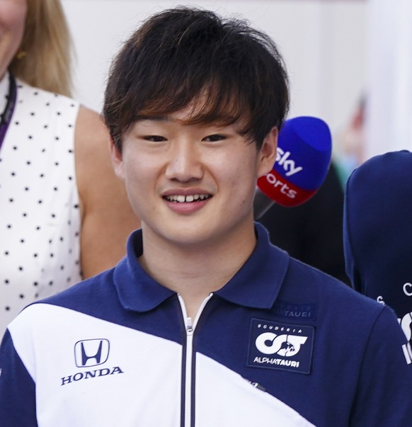 epa09537873 Japanese Formula One driver Yuki Tsunoda of Scuderia AlphaTauri Honda plays a game with his teammate French Formula One driver Pierre Gasly of Scuderia AlphaTauri Honda in the paddock at t ...