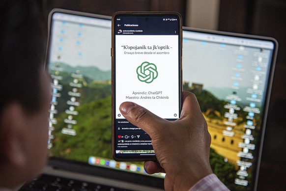 epa12396953 Teacher Andres ta Chikinib shows his phone during an interview with EFE in San Cristobal de las Casas, Mexico, 21 September 2025. Chikinib, a communications specialist, poet, and bilingual ...