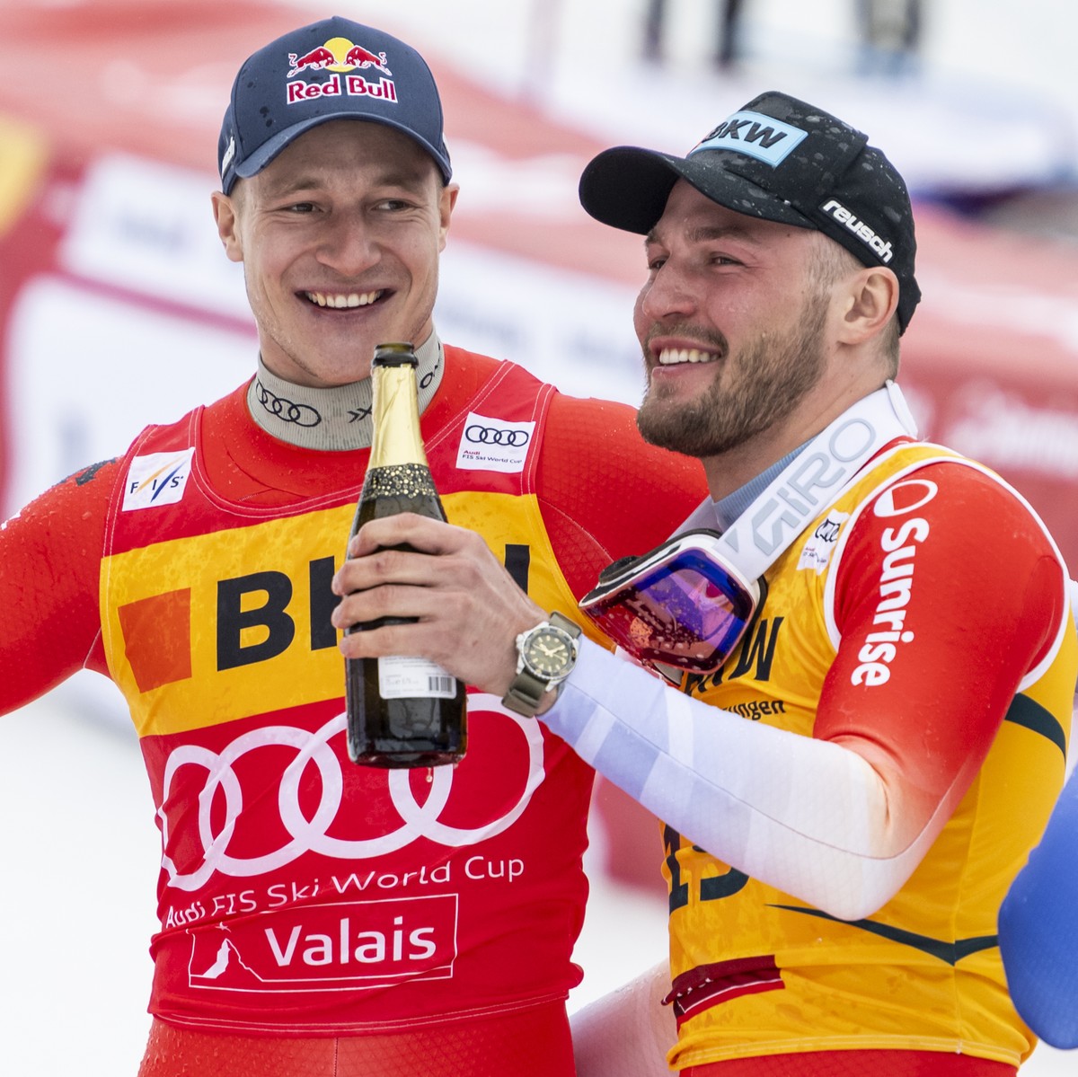 Winner Marco Odermatt of Switzerland, second placed Alexis Monney of Switzerland, and third placed Dominik Paris of Italy, from left, celebrate with champagne after the podium ceremony at the conclusi ...