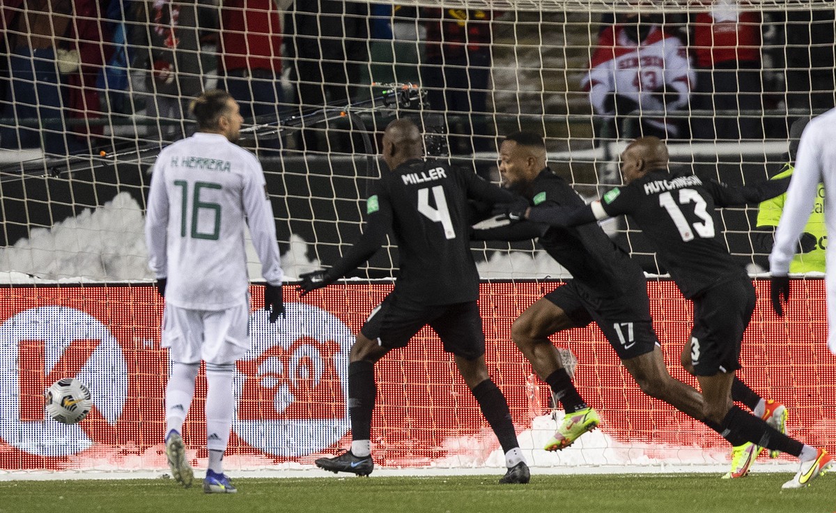 Canada's Cyle Larin (17), Kamal Miller (4) and Atiba Hutchinson (13) celebrate a goal against Mexico during the second half of a World Cup soccer qualifying match in Edmonton, Alberta, Tuesday, N ...