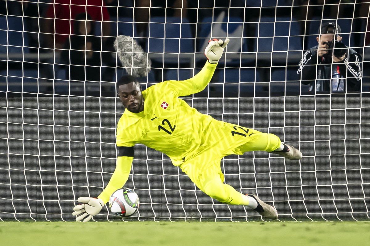 Switzerland's goalkeeper Yvon Mvogo stops a penatly by Spain's midfielder Pedri, during the UEFA Nations League soccer group A4 match between Spain and Switzerland at Heliodoro Rodriguez Lop ...
