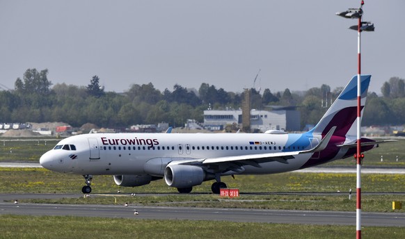 Seasonal workers from Romania arrive with a special Eurowings flight due to the coronavirus outbreak at the airport in Duesseldorf, Germany, Friday, April 17, 2020. Workers are flying to Germany in co ...