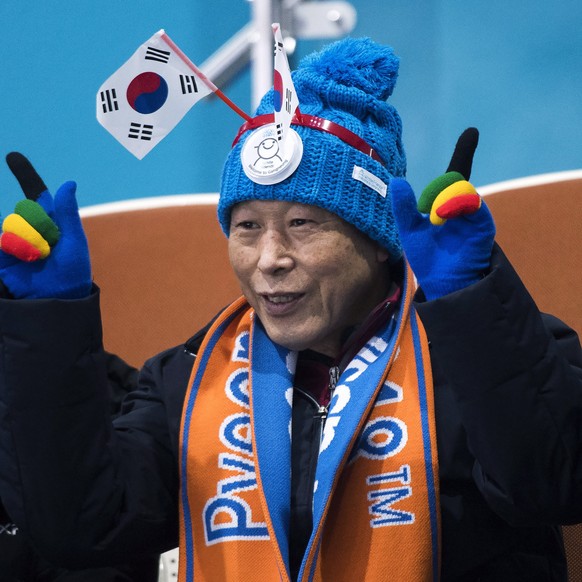 South Korean fans cheer while watching a mixed double curling match at the 2018 Winter Olympics in Gangneung, South Korea, Thursday, Feb. 8, 2018. (Nathan Denette/The Canadian Press via AP)