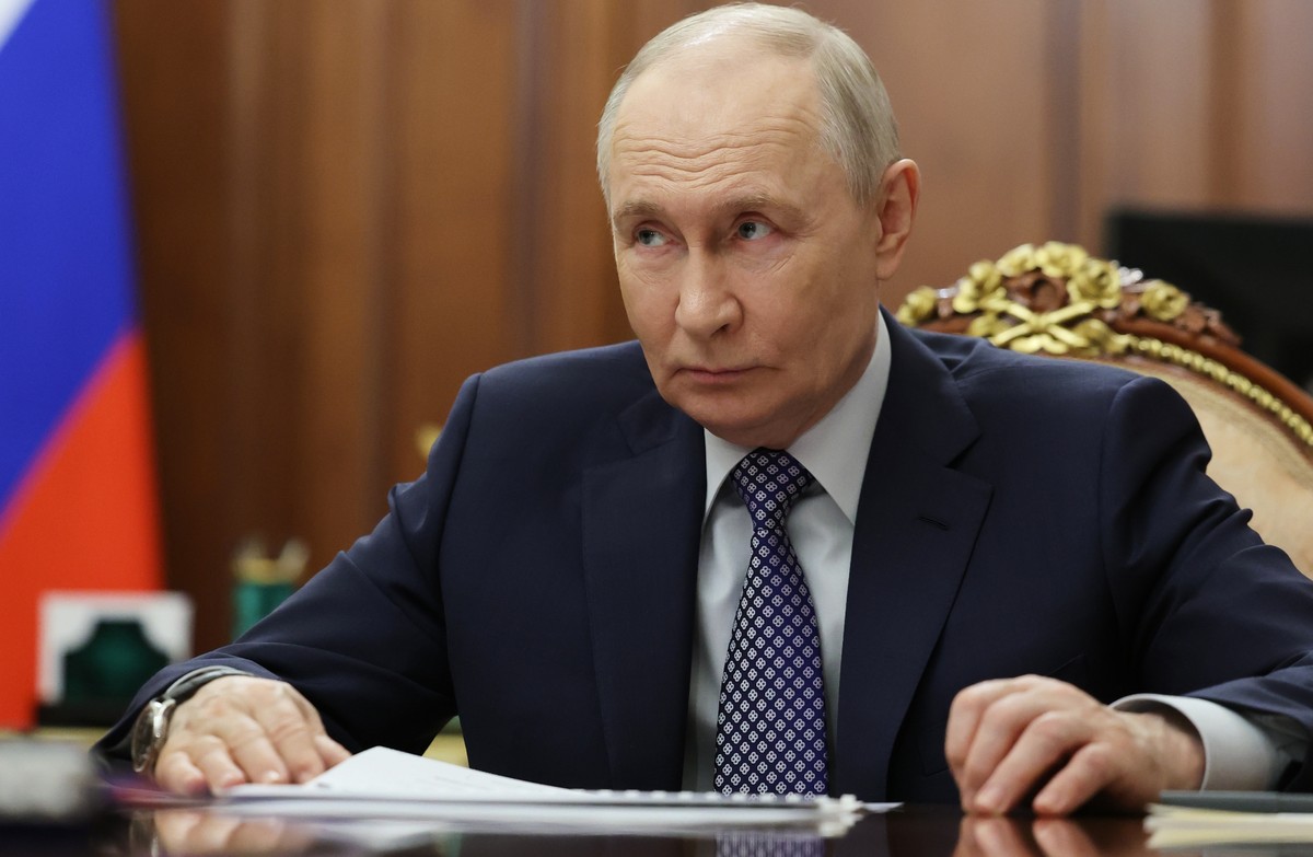 Russian President Vladimir Putin listens to Deputy Prime Minister, Chief of the Government Staff Dmitry Grigorenko during their meeting at the Kremlin, in Moscow, Thursday, April 9, 2026. (Alexander K ...