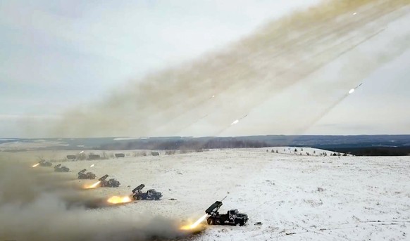 FILE - In this image taken from video and released by Russian Defense Ministry Press Service, Russian rocket launchers fire during military drills near Orenburg in the Urals, Russia, Dec. 16, 2021. Wi ...