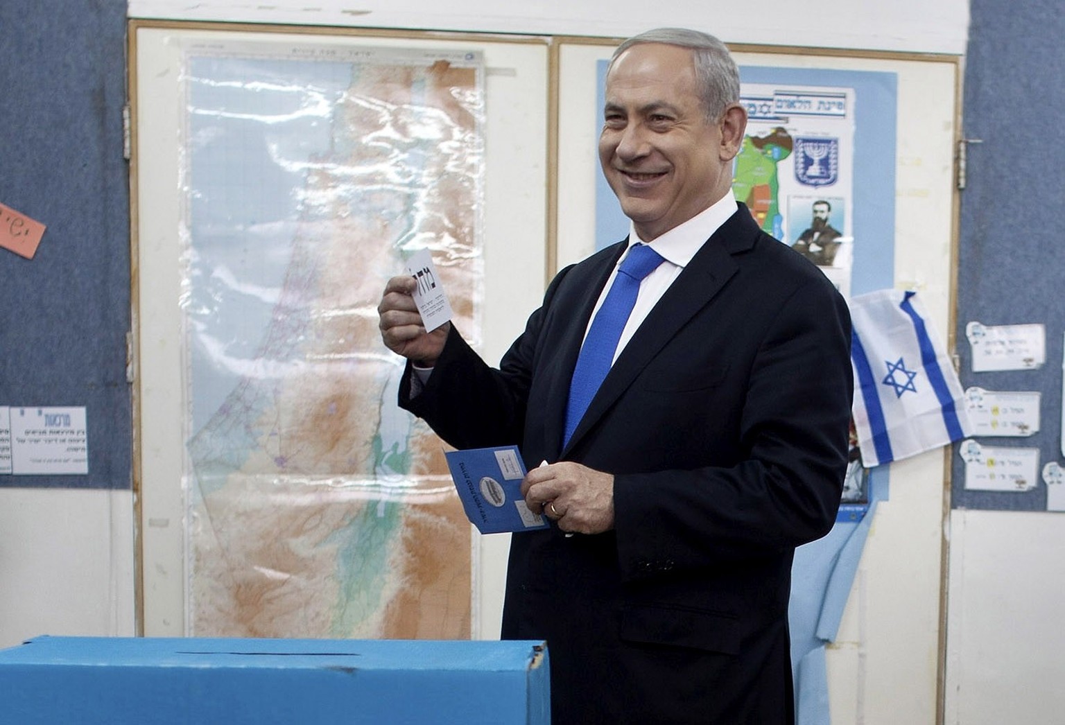 Israeli Prime Minister Benjamin Netanyahu casts his ballot at a polling station in Jerusalem, Tuesday, Jan. 22, 2013. Israelis headed to polling stations Tuesday to cast votes in a parliamentary elect ...