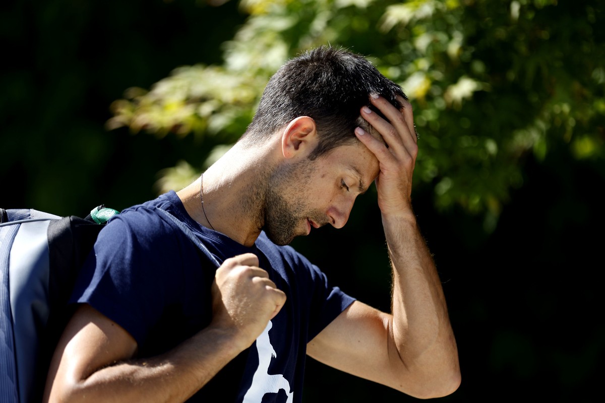 Serbia's Novak Djokovic gestures, ahead of the Wimbledon Tennis Championships, at the All England Lawn Tennis and Croquet Club, in Wimbledon, London, Wednesday June 22, 2022. (Steven Paston/PA vi ...