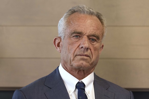 Health and Human Services Secretary Robert F. Kennedy Jr. listens during a press conference about Utah's new fluoride ban, food additives and SNAP funds legislation, Monday, April 7, 2025, in Sal ...