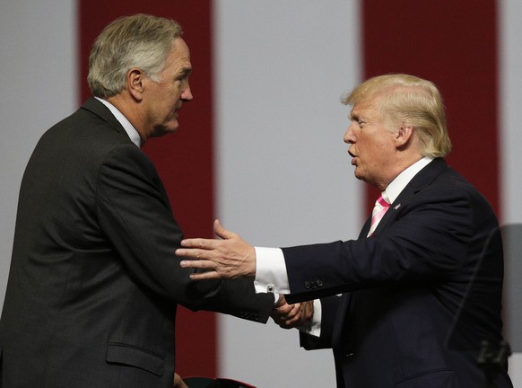 President Donald Trump shakes the hand of Sen. Luther Strange after he speaks at campaign rally, Friday, Sept. 22, 2017, in Huntsville, Ala. (AP Photo/Brynn Anderson)