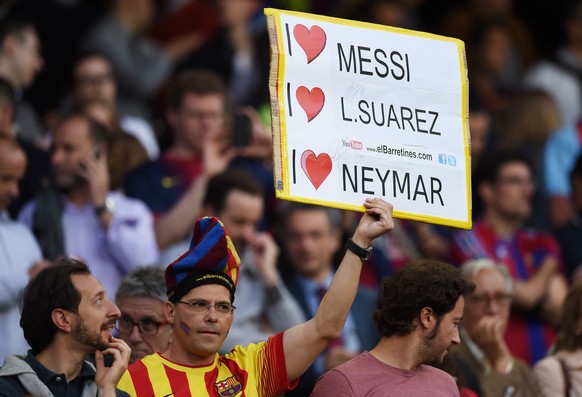 BARCELONA, SPAIN - MAY 06: A Barcelona fan cheers on his team during the UEFA Champions League Semi Final, first leg match between FC Barcelona and FC Bayern Muenchen at Camp Nou on May 6, 2015 in Bar ...